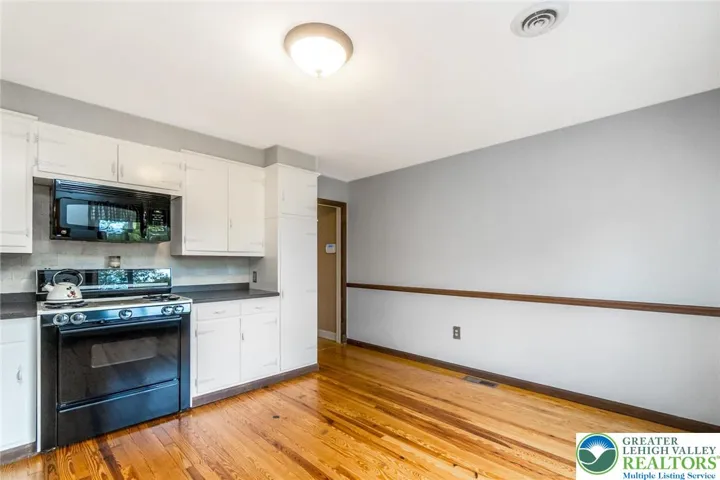 Kitchen with built-in microwave, gas stove top and oven