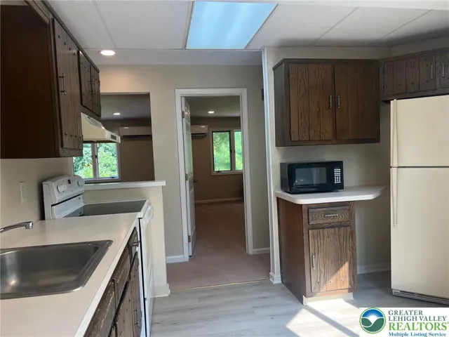 Kitchen view to bedroom on right (BR #1) entry