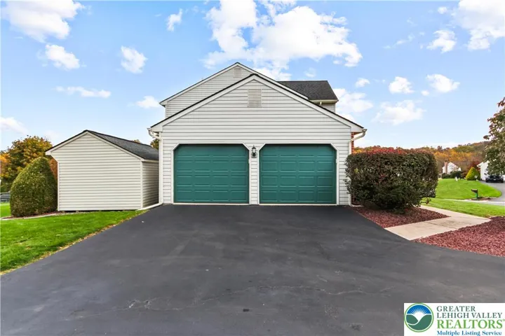 A side access, 2 Car Garage w/ Electronic Entry