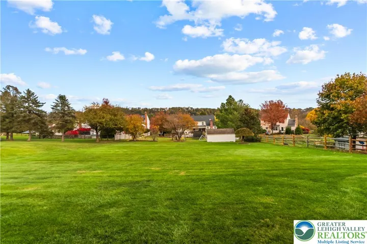 This 1/2 acre lot has an amazing flat back yard