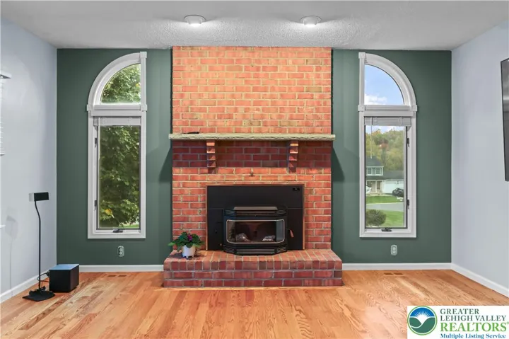 This Great Room boasts a Breckwell Pellet Stove Insert for cozy warmth & charm