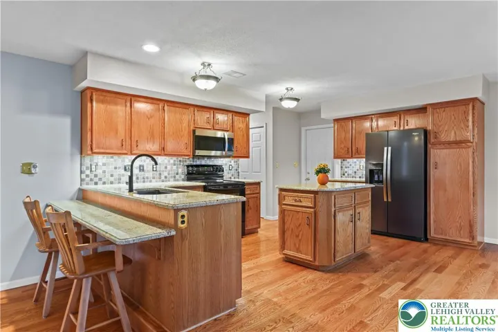 Gleaming Hard Wood Floors, Granite Counters, Solid Oak Cabinets