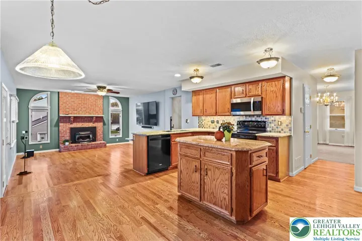 The Kitchen steps down into the comfortable Family Room