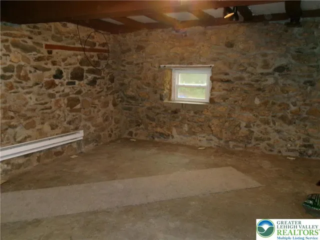 Living Room, Kitchen combo.  Tenant will need area carpets down here for sure.