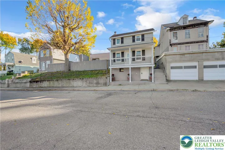The adjacent home to the right of the lot is for sale also.
