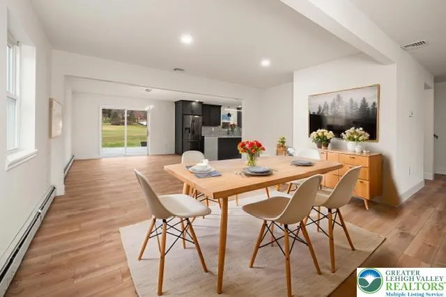 Virtually staged dining room with breakfast knook area