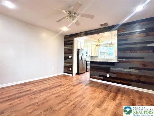 living room with wooden accent wall