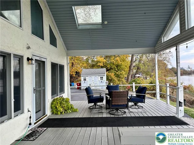 Large, covered porch overlooking the river