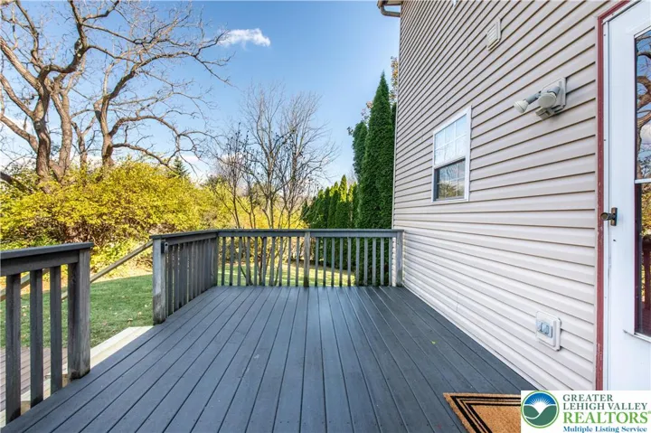 Trex Deck with stairs down to a lower deck and the firepit.