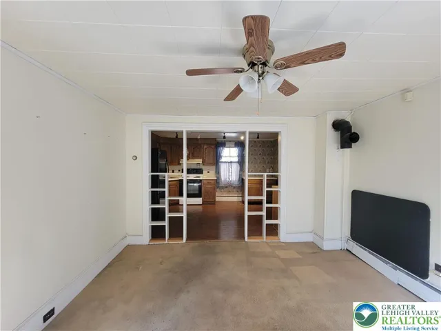 Dining room w/ wide opening to kitchen