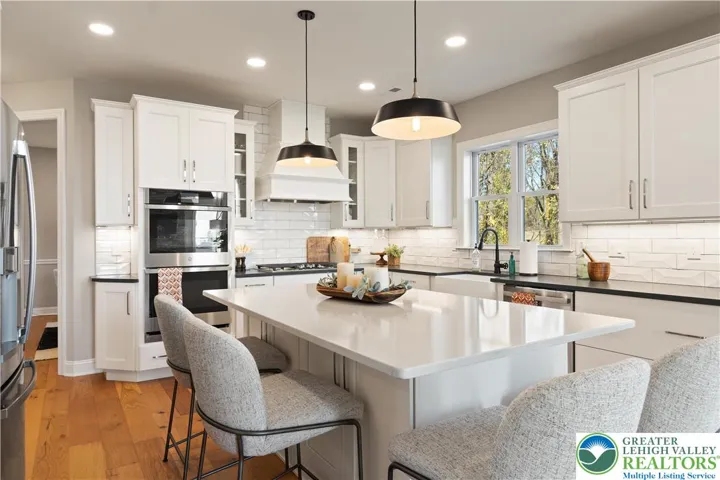 Kitchen *Photos are of a previously built model home. Features, finishes, and options may vary*