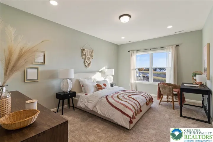 Bedroom *Photos are of a previously built model home. Features, finishes, and options may vary*