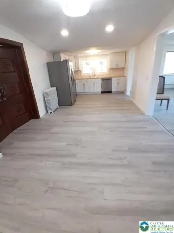 Looking from dining room into kitchen