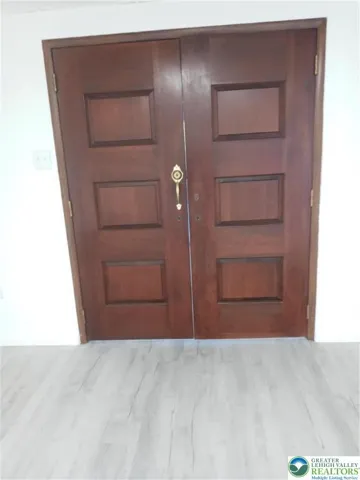 Beautiful wooden doors lead into family room