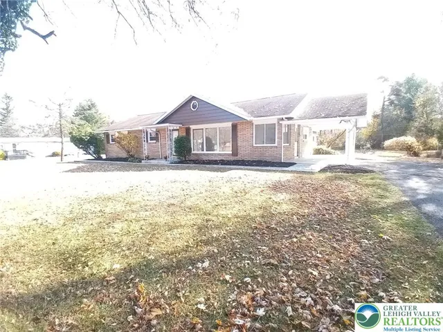 Front of home with covered side patio