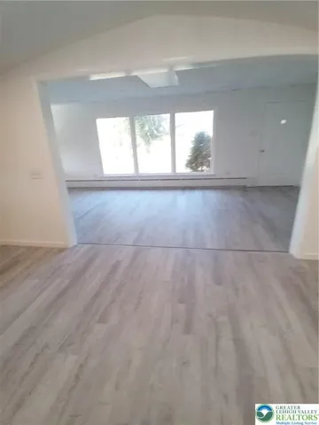 Looking from dining room into living room
