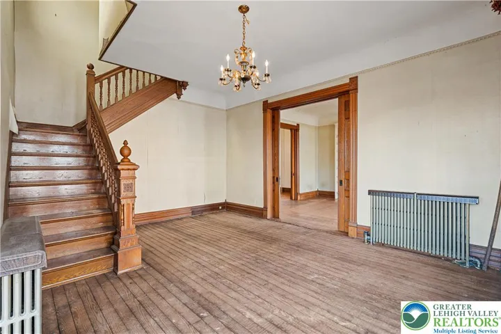 Original hardwood floors, tall 9 foot ceilings, original wood pocket doors, original woodwork