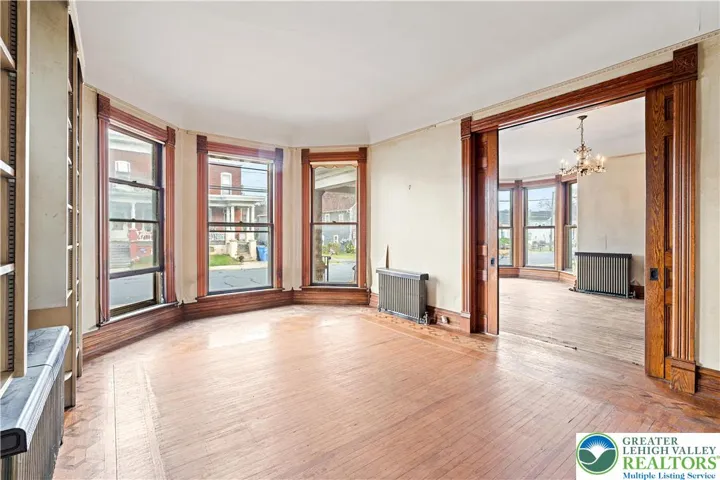 Original woodwork, original hardwood floors, built in bookshelves
