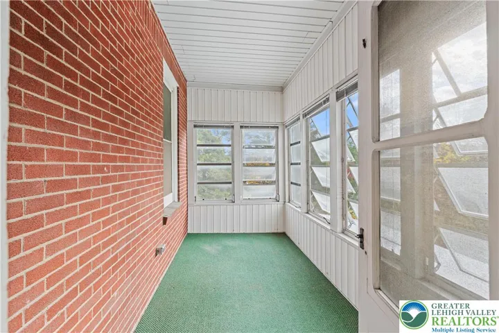 Enclosed second floor porch