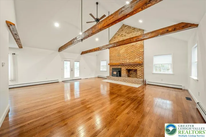 Family Room, Vaulted Ceilings, Large Brick Fireplace