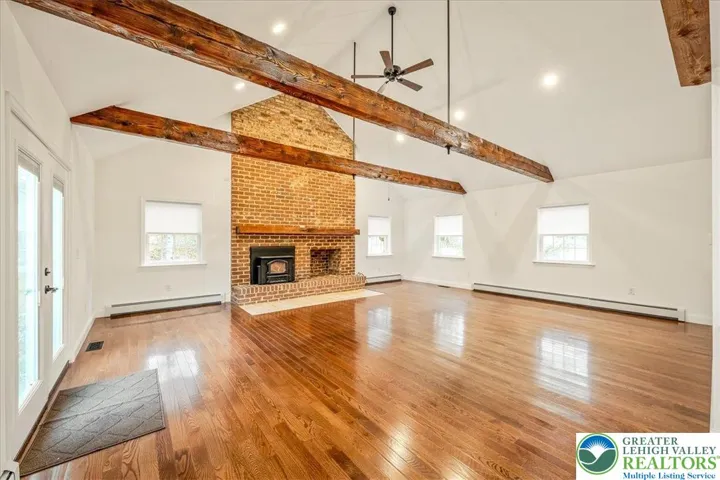 Family Room, Vaulted Ceilings, Large Brick Fireplace