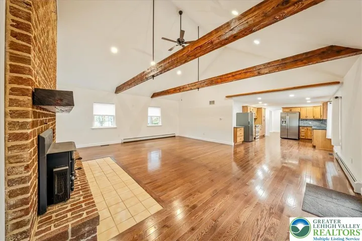 Family Room, Vaulted Ceilings, Large Brick Fireplace