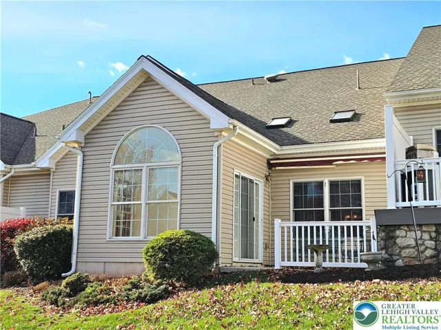 Rear patio with privacy fence and railing