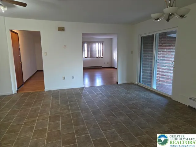 Standing in dining g area looking g into the living room