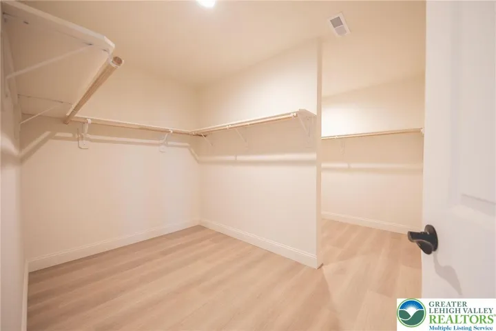 Primary bedroom double closet.