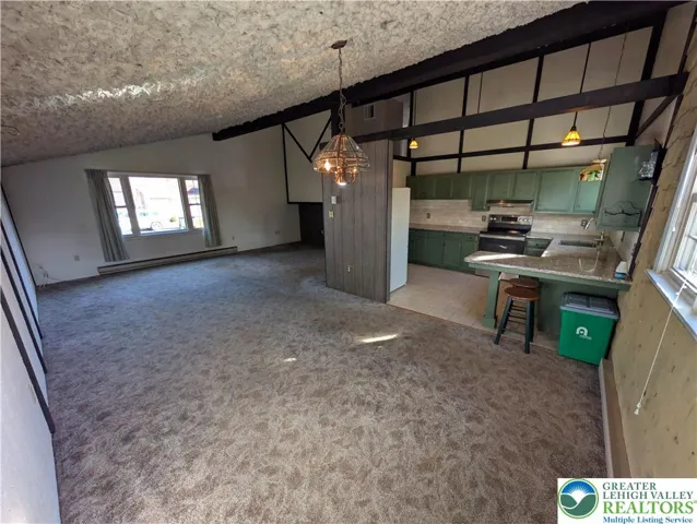 Dining room with view of living room and kitchen