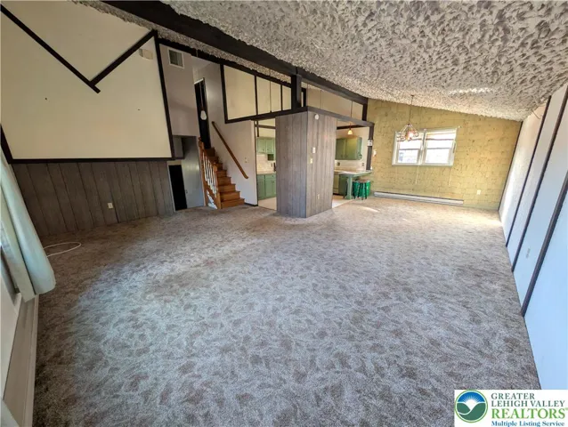Living room with view of dining room