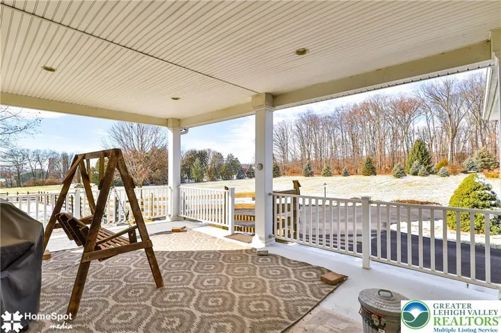  Side Patio - View of Property Treeline