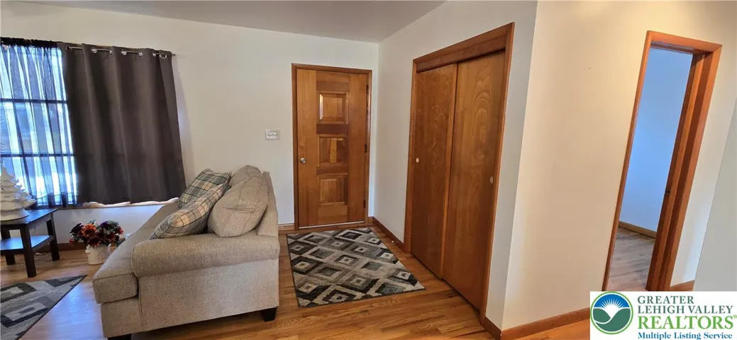Entry with refinished hardwood floors