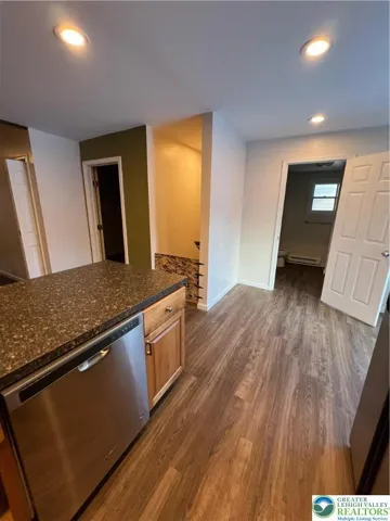 Off the kitchen is the entrace for 2nd bedroom, main bathroom, and deck