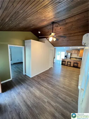 Off of the living room is the entrance to the primary bedroom