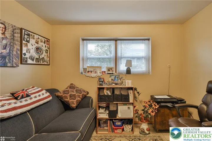 Lower-level den (possible 4th bedroom)