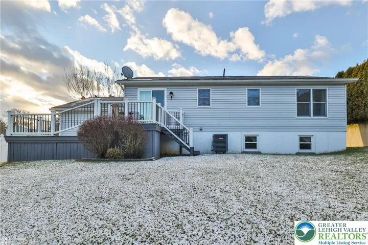 Rear of home with multi-tier composite decking