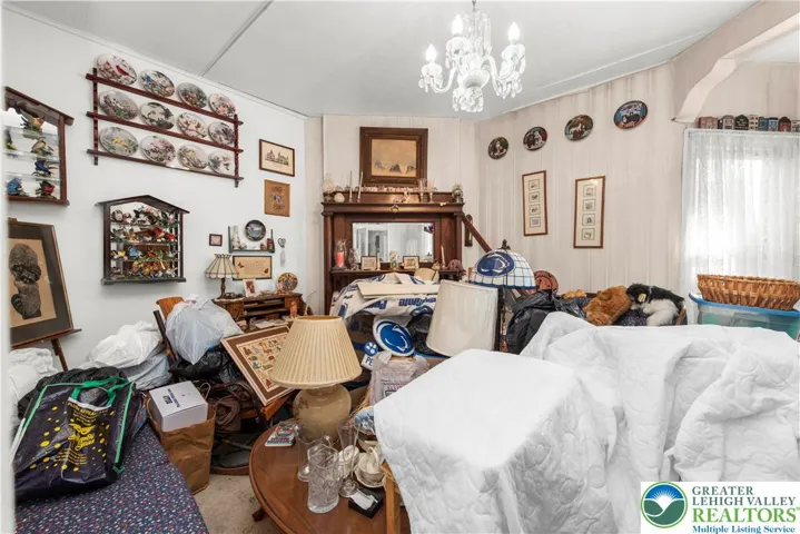 Front room with wood mantle