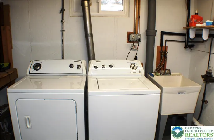 Laundry is down in the untility room in the basement - Washer & Dryer remain