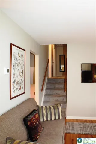 Back in the living room, looking up to the bedroom (top) level