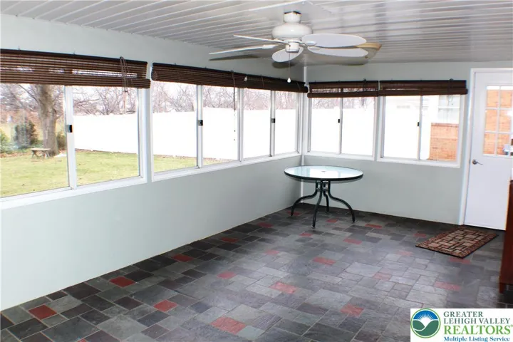 LARGE Sunroom is off the back of the Family room
