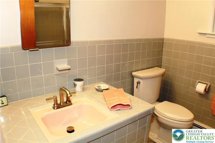 Main Bath - updated but with original tile
