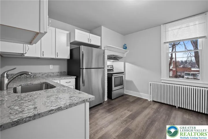 Kitchen with fireplace.