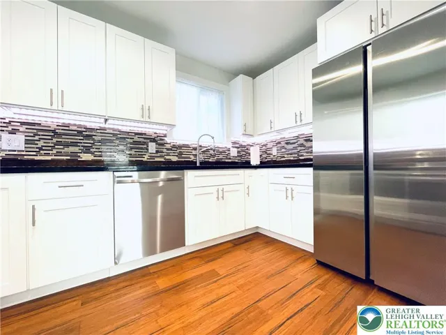 The kitchen features high-efficiency stainless steel appliances that blend style and everyday convenience.