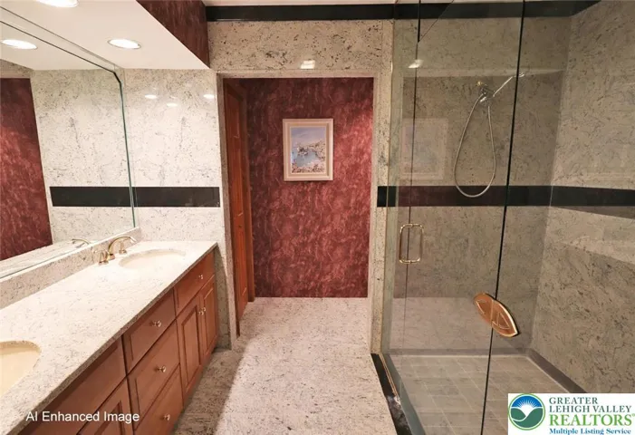 1st floor primary bedroom bathroom with granite shower and countertops