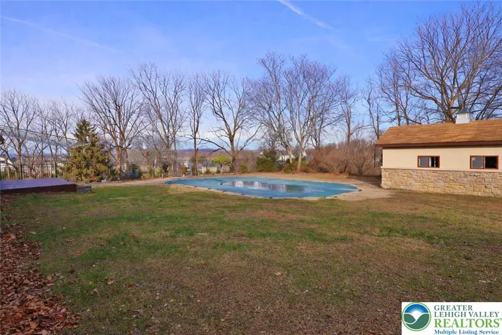 Fenced-in yard area near pool