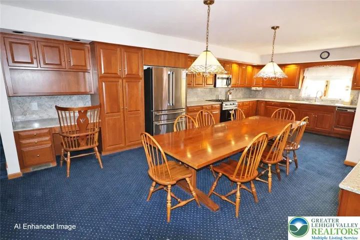 Eat-in kitchen with cherry cabinetry and granite countertops