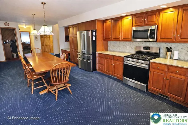 Eat-in kitchen with cherry cabinetry and granite countertops