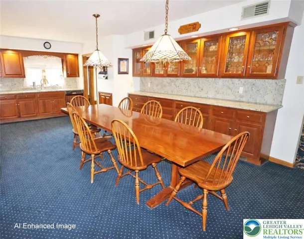 Eat-in kitchen with cherry cabinetry and granite countertops