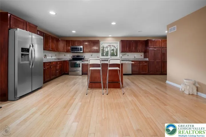 Large kitchen with granite tops